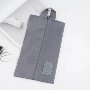 Portable travel shoe bag waterproof dustproof storage pouch with zipper and top handle grey.