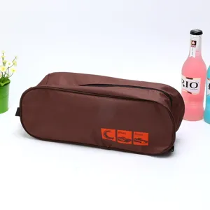 Portable travel shoe bag made of durable Oxford cloth with convenient zipper and handle storage.