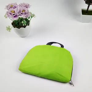 Foldable lightweight oxford cloth travel backpack detail view, green compact storage bag.