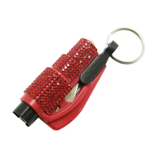 Detailed macro view of the red rhinestone-encrusted 2-in-1 portable car safety window breaker tool