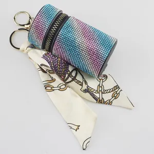 Detailed view of gradient rhinestone keychain with a stylish chain pattern silk scarf.