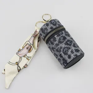 Luxury leopard rhinestone lipstick holder keychain featuring a decorative silk scarf charm