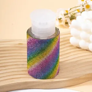 Detailed close-up of a 200ml refillable pump bottle featuring vibrant rainbow rhinestone.