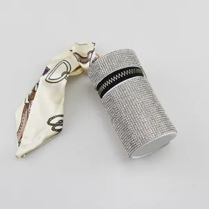 Luxury rhinestone-encrusted lipstick keychain with elegant silk scarf accessory detail