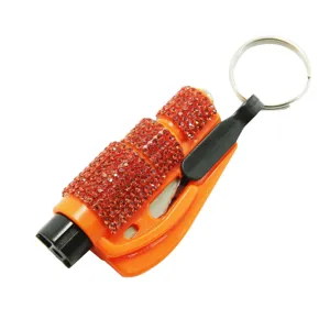 Detail of orange car window breaker tool decorated with red sparkling rhinestones