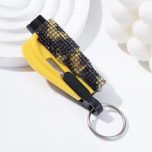 Detailed view of rhinestone-encrusted car window breaker and safety hammer keychain