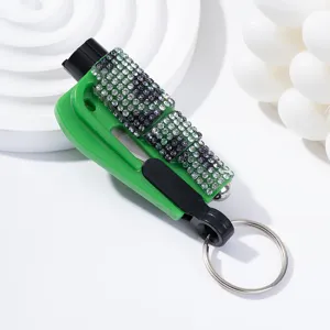 Detailed close-up view of the rhinestone-studded green car safety hammer with key ring