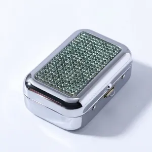 Portable silver metal cigarette case with sparkling green rhinestone inlay design
