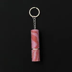Close-up of pink rhinestone encrusted 5ml refillable perfume atomizer keychain detail