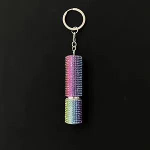 Close-up detail of a 5ml portable refillable perfume atomizer keychain with rainbow rhinestones