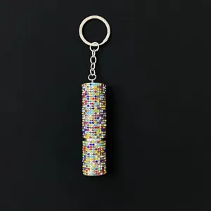 Close-up view of a sparkling rhinestone-encrusted 5ml portable perfume atomizer keychain