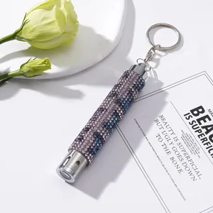 Detail view of the sparkling purple and blue rhinestones on this mini LED flashlight keychain.