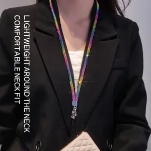 Macro view of a luxury colorful rhinestone lanyard worn over a professional black blazer