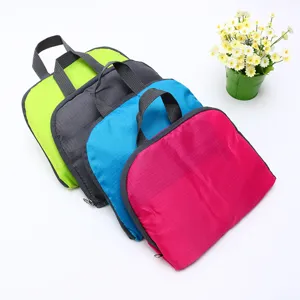 Lightweight foldable travel storage bag in various vibrant colors made of durable oxford cloth.
