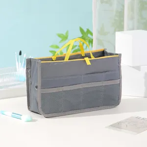 Graue multifunktionale Organizer-Tasche mit gelben Griffen, Make-up-Tasche mit Fächern.