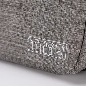 Portable grey travel toiletry bag with wash icons, durable fabric cosmetic organizer pouch.