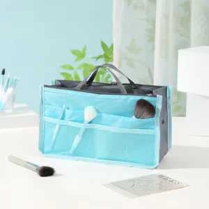 Detailansicht der blauen Mehrfachtaschen-Organizer-Tasche mit Netzfächern und Griffen.