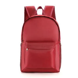 Roter wasserdichter Schulrucksack für Studenten, lässiger Reiserucksack mit Fronttasche.