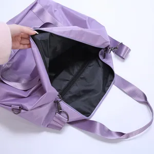 Large capacity travel duffel bag interior detail, purple waterproof luggage storage organizer