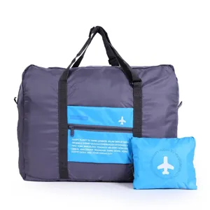 Detailed view of large capacity folding travel duffel bag with trolley sleeve and storage pouch.