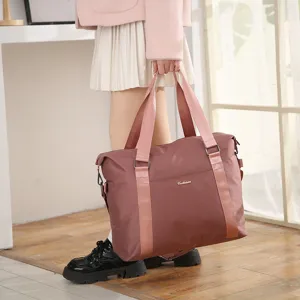 Large capacity waterproof travel duffel bag for clothing storage and outdoor trips.