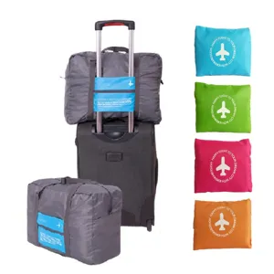 Foldable travel luggage bag with trolley sleeve, large capacity portable storage bag for trips.