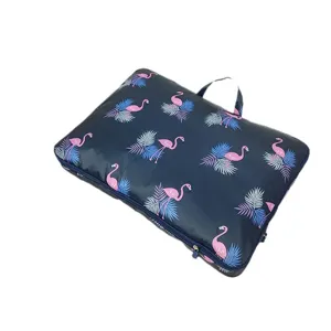 Sac de rangement de voyage en tissu Oxford avec imprimé flamant rose et poignée pratique.