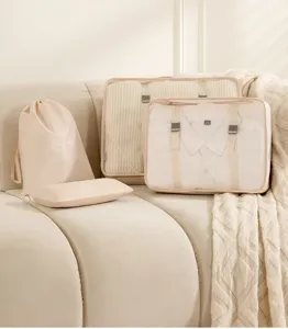 Juego de cubos de embalaje de viaje beige, bolsas organizadoras de equipaje portátiles con red.