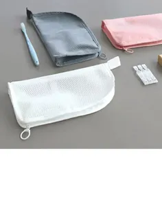 Detail view of portable mesh travel wash bag showing zipper closure and breathable design.