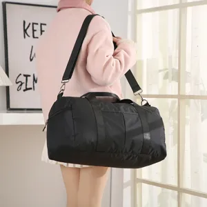 Large capacity travel duffel bag for gym, sports, and weekend getaways. Black waterproof.