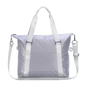 Large capacity travel bag waterproof portable luggage bag stylish grey tote for business trips.