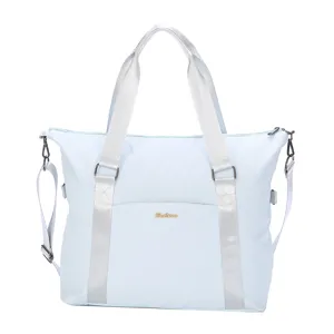 Full view of light blue large capacity travel bag with silver straps