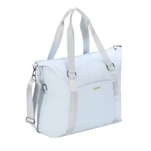 Side angle view of a light blue large capacity waterproof travel tote bag with silver straps