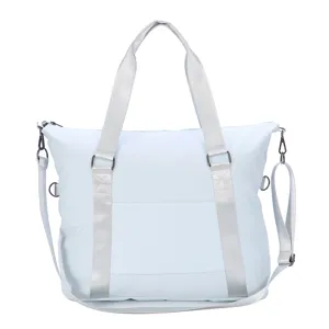 Front view of a light blue large capacity waterproof travel and sports bag with handles