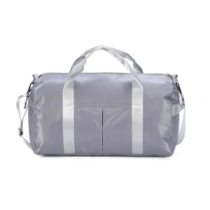 Grey travel duffel bag with large capacity, dry wet separation, and shoulder strap.