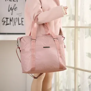 Large capacity pink travel bag, waterproof overnight duffel bag, portable luggage tote for women.