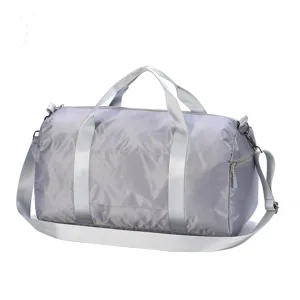 Grey travel duffel bag detail, large capacity gym bag with shoulder strap and durable zippers.