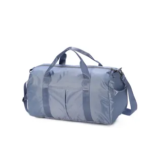 Blue travel duffel bag detail, durable nylon gym bag, large capacity storage handle.