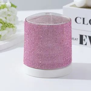 Close-up detail of a pink rhinestone-encrusted 48-hole nail drill bit storage box