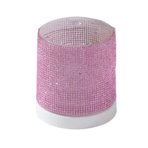 Close-up of pink rhinestone 48-hole nail drill bit storage box and display base.