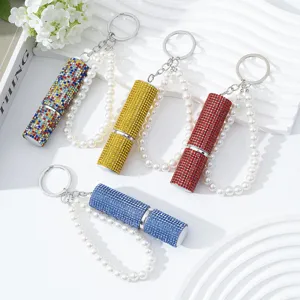 Group detail of colorful rhinestone perfume spray bottles with elegant pearl keychains