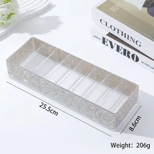 Elegante caja joyero con 7 compartimentos y pedrería, dimensiones 25,5 cm x 8,6 cm.