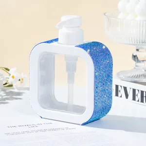 Close-up detail of luxury blue rhinestone encrusted square white pump bottle dispenser