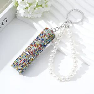 Detail view of 5ml perfume bottle with colorful rhinestones and pearl keychain