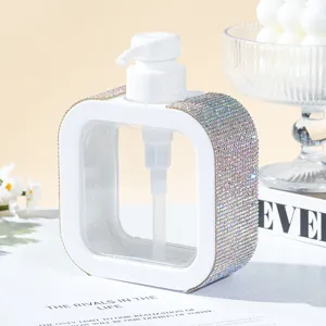 Close-up of the sparkling rhinestone detail on the white square refillable bottle
