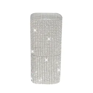 Macro view of luxurious rhinestone-covered portable cotton swab organizer for travel