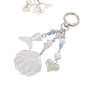 Porte-clés océan en acrylique avec coquillage, queue de poisson et paillettes irisées