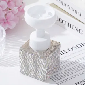 Close-up of luxury rhinestone foaming soap dispenser with flower-shaped pump head