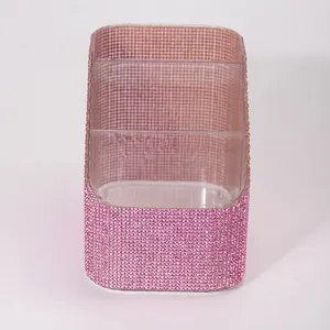 Close-up detail of pink sparkling rhinestone multi-grid makeup brush storage organizer