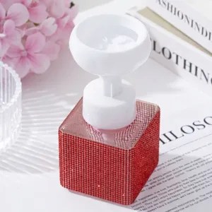 Detailed macro shot of red rhinestone covered base and white flower shaped foam pump head